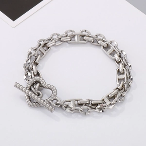 Detailed view of silver titanium chain bracelet with OT toggle clasp and anchor links