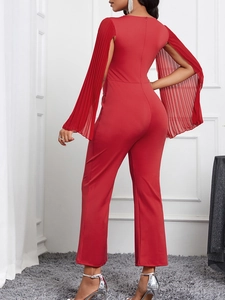 Elegant red slim fit jumpsuit featuring pleated cape sleeves and a back zipper closure