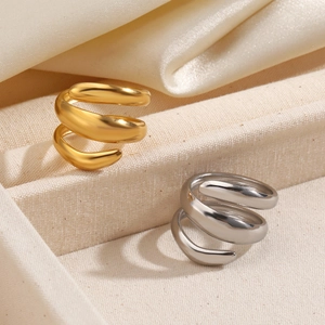 Minimalist thick spiral line open ring in gold and silver finish on soft fabric