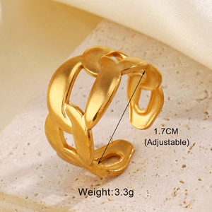 Detail of adjustable gold chain ring on stone texture with 1.7cm diameter and 3.3g weight