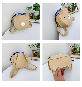 Detail view of khaki bear bag showing front, side, back and bottom with checkered lining