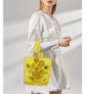 Detail of Van Gogh Sunflowers art printed on a yellow canvas bucket handbag for women