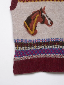 Detail shot of vintage knit vest featuring horse pattern and geometric jacquard texture