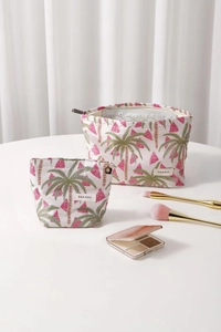 Detail of jacquard fabric makeup bags with palm tree and watermelon patterns