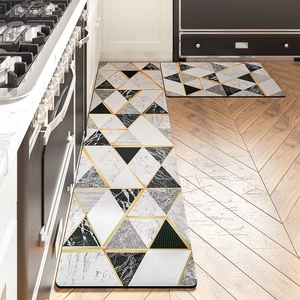 Macro detail of geometric marble kitchen mat set with non-slip texture and gold lines