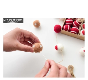 Close-up of hands threading colorful wool felt balls with jute rope for DIY decor