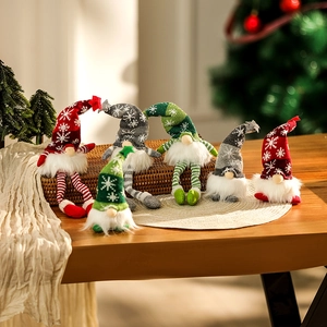 Close-up of festive Christmas gnomes set with snowflake knit hats and faux fur beards