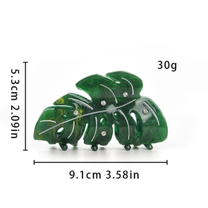 Green leaf hair claw with glitter and rhinestones showing size 9.1cm and 5.3cm