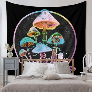 Detail view of psychedelic mushroom wall tapestry hung as a headboard in a cozy bedroom