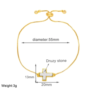 Detailed view of adjustable gold cross bracelet with 13x20mm druzy stone pendant