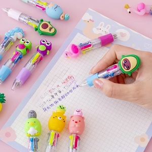 Cute cartoon 4-color mini ballpoint pen with silicone toppers on pink notebook