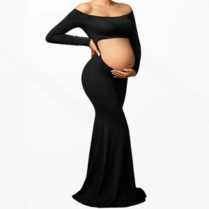 Off-shoulder long sleeve maternity maxi dress with abdominal cutout in black knit fabric