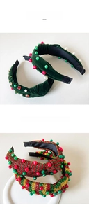 Detail of Christmas headband featuring green velvet fabric with rhinestones and faux pearls