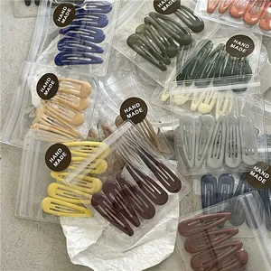 Detailed view of matte Morandi color metal BB hair clips in small transparent bags