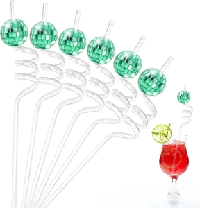 Green disco mirror ball ornaments on spiral straws with red drink in a glass
