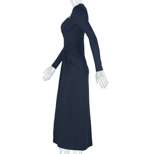Detailed side view of navy blue ruched waist design on a slim fit long sleeve maxi dress