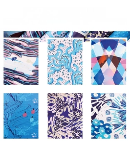 Artistic gift wrapping paper featuring blue and purple abstract patterns for DIY crafts