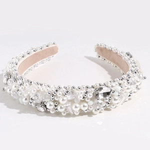 Close-up of luxury padded headband featuring white faux pearls and clear crystals