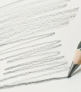 Macro detail of pencil graphite texture and sketching lines on white drawing paper