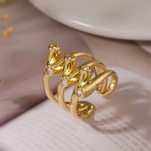 Macro shot of gold spiral wrap ring featuring clear zircons in a multi-layered design