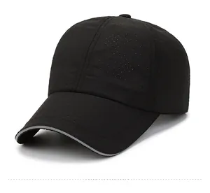 Detail of black breathable baseball cap with reflective brim edge and mesh fabric