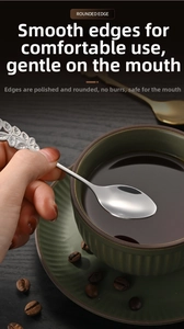 Detailed close-up of stainless steel rose spoon showing refined leaf texture and rounded edges