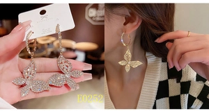 Close-up of sparkling S925 silver butterfly tassel earrings with pavé crystals