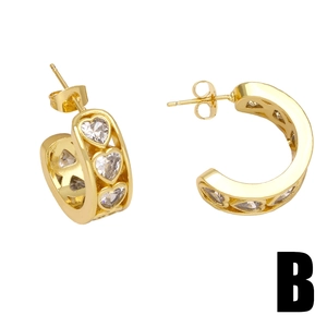 Gold-plated C-shaped heart earrings with sparkling cubic zirconia on white background