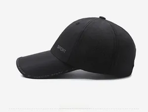 Detail view of breathable micro-mesh fabric on a black quick-dry sports baseball cap