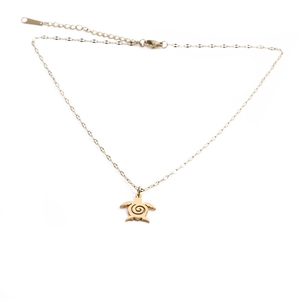 Minimalist gold stainless steel necklace featuring a sea turtle shaped pendant on white background