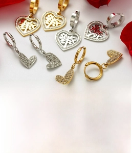 Close-up of titanium steel heart earrings with Tree of Life design and zircon inlay