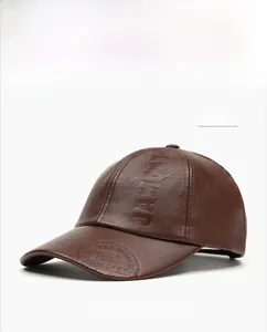 Detail of khaki PU leather baseball cap featuring embossed JAMONT 1985 logo and texture