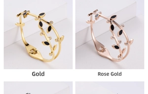 Detail of leaf-shaped hinge bracelets in gold and rose gold with black enamel and zircons