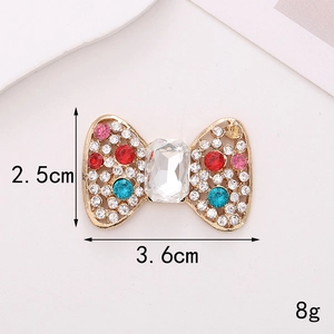 Detail shot of a crystal bow accessory with dimensions 3.6cm by 2.5cm and 8g weight