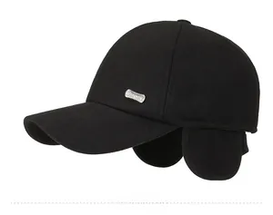 Detail of winter baseball cap with ear flaps and silver SPORT metal side emblem