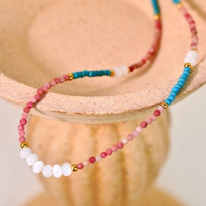 Handmade beaded necklace with natural pink and blue stones and 18K gold plated spacers