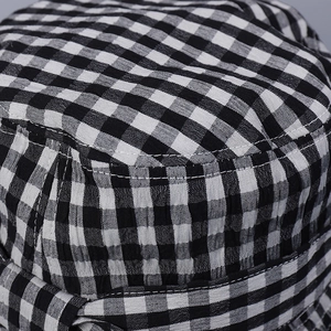 Chic black and white gingham bucket hat for women with elegant bow and sun protection