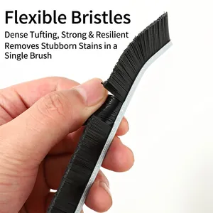 Durable gap cleaning brush with dense black bristles and flexible metal handle frame