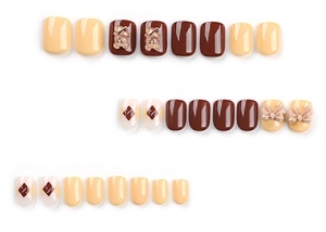 Detail of handmade press on nails with teddy bear, bows and diamond lattice pattern