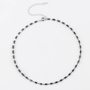 Elegant necklace featuring black rectangular zircon stones on a polished silver chain