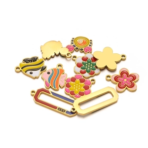 Gold-plated stainless steel enamel pendants featuring colorful fish and flower designs