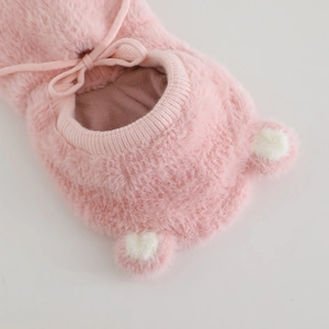 Detail of pink plush hat featuring cute bear ears with ribbed collar and drawstring