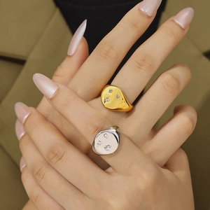 Star-patterned stainless steel rings with 18K gold plating and micro-set diamonds