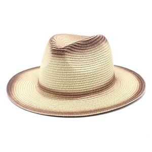 Close-up of the beige and brown gradient woven paper straw jazz fedora with texture details