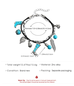 Detail view of vintage multi-charm bracelet with cowboy boot and turquoise bead