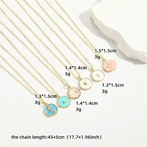 Minimalist gold birthstone pendant necklaces with various colors and star charms