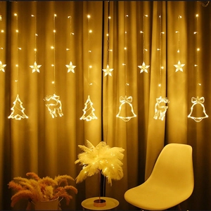 Warm white LED curtain lights featuring stars and Christmas trees for festive indoor decoration