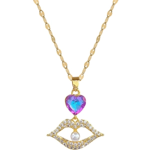 Gold lip pendant necklace with heart gemstone, rhinestones and pearl on white background