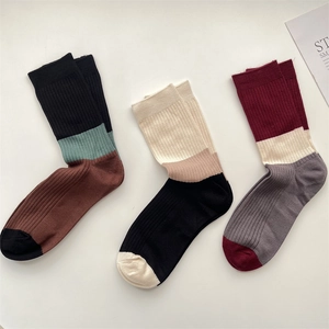 Three pairs of warm cashmere-blend crew socks with retro stripes and ribbed textures