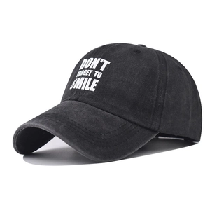 Washed cotton baseball cap with Don't Forget to Smile embroidery in black vintage style